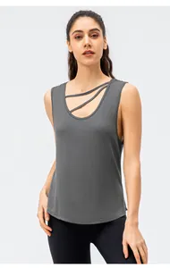 Detailed view of a grey loose yoga tank top featuring a stylish criss-cross neckline design