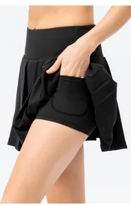 Close-up detail of black sports pleated tennis skirt featuring a convenient side pocket