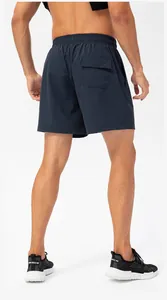 Rear view of navy blue quick-dry sports shorts with elastic waistband and back pocket.