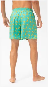 Back view of men's quick-dry beach shorts featuring a vibrant yellow banana print pattern