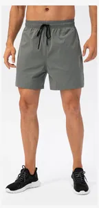 Lower body view of grey quick-dry running shorts with black drawstring.