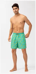 Men's quick-dry beach shorts with yellow banana pattern on teal background