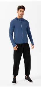Full body view of a man wearing a breathable anti-UV sun protection hoodie jacket