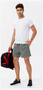 Model wearing gray quick-dry sports shorts for running and fitness training sessions