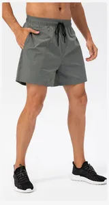 Front view of men's quick-dry sports shorts in grey with elastic drawstring waist
