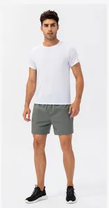 Professional studio shot of a male model wearing men's quick-dry athletic shorts in gray