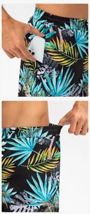 Detail view of men's quick-dry beach shorts showing elastic waist and side pocket.