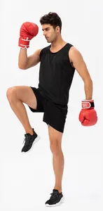 Detailed view of men's loose quick-dry sports shorts worn during a boxing training session