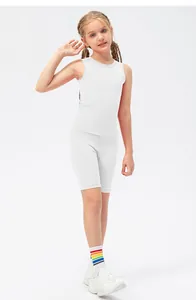 Full view of girl wearing a white quick-dry sports tank top and matching biker shorts