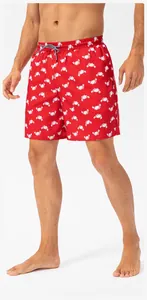Detailed shot of red quick-dry men's swim trunks featuring a playful white crab print pattern