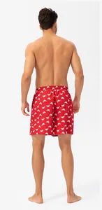 Back view detail of men's quick-dry red beach shorts with white crab pattern print