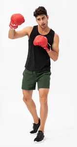 Full detail of men's dark green quick-dry sports shorts with elastic waist for running