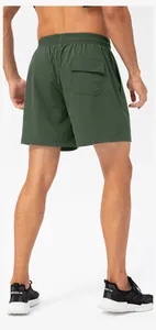 Detailed back view of men's quick-dry olive green athletic shorts featuring a flap pocket