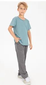 Young boy wearing breathable grey quick-dry loose sports pants for casual athletic wear