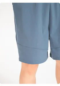 Detail of children's blue quick-dry sports shorts showing fabric texture and stitching