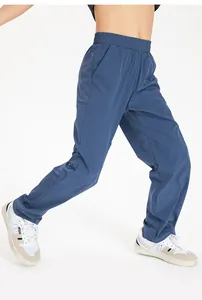 Detail shot of blue kids' loose quick-dry sports pants, ideal for running and gym