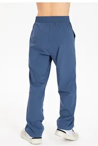 Detailed back view of boys loose navy blue quick-dry nylon sports pants for fitness