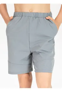 Close-up view of children's grey quick-dry nylon athletic shorts on a model for sports