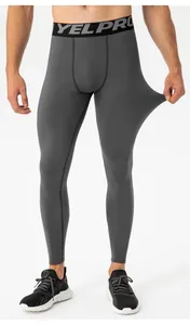 Detail view showing high elasticity of men's grey fleece-lined sports compression pants