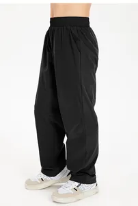 Detailed side profile of children's baggy black nylon quick-dry sports joggers