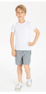 Full length view of a young boy wearing grey breathable quick-dry sports shorts
