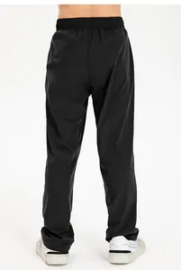 Detailed back view of boys black loose sports track pants in quick-dry nylon fabric
