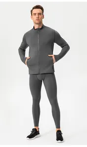Full-body view of men's thermal compression athletic set in grey for gym training