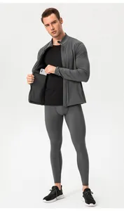 Detail showing men's gray thermal sports set with internal phone pocket feature.