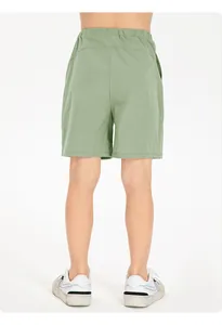 Back view of children's green quick-dry breathable sports shorts for running and basketball