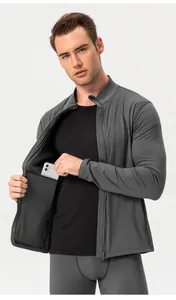 Detail view of men's thermal sports jacket showing inner smartphone pocket feature.