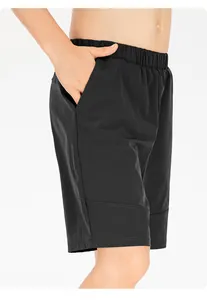 Close-up detail of children's black quick-dry sports shorts with pocket and elastic waist