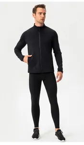 Full body view of man in black fleece-lined thermal sports leggings and compression top