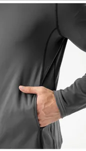 Detailed macro view showing the side pocket and fabric texture of grey athletic jacket