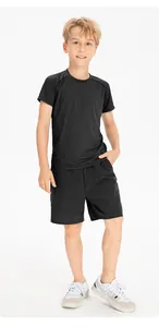 Full view of boy wearing breathable black quick-dry sports t-shirt and shorts set.
