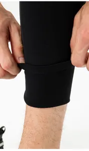 Close-up of men's thermal leggings showing high elasticity and soft fleece lining