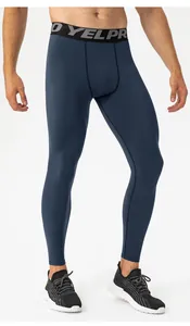 Detail view of men's blue thermal compression leggings for high-performance fitness training.