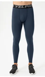 Detail view of men's thermal compression gym leggings with elastic YELPRO waistband