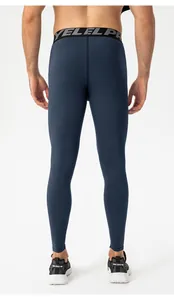 Back view of professional men's dark blue compression leggings for fitness training