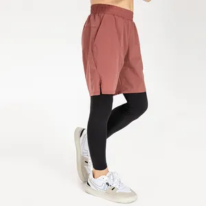 Atmungsaktive Kinder-Sportleggings im Fake-Two-Piece-Design mit locker sitzenden Shorts in Rot