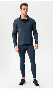 Front view of men's navy blue thermal compression jacket and leggings set for sports