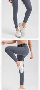 Close-up of slate blue high-waisted yoga leggings with butt-lifting and side pocket details