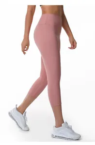 Side view of pink high-waisted nude feel yoga capri leggings for fitness and running