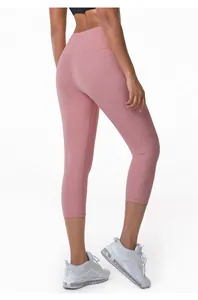 Back view of pink high-waisted yoga capris with butt-lifting fit for fitness.