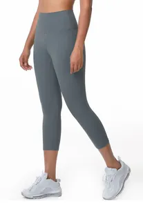 Detail view of grey high-waisted yoga capri pants for women's fitness and running