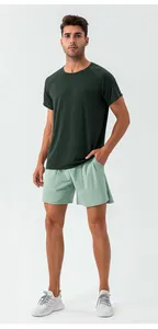 Full body front view of men's quick-dry breathable athletic training shorts in light green