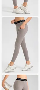 Close-up of grey yoga leggings featuring a side pocket and UPGRADE waistband