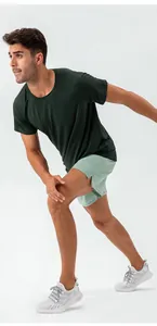 Professional athlete in breathable quick-dry men's running shorts and green top