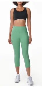 Detailed view of mint green high-waisted yoga capri leggings for fitness and running