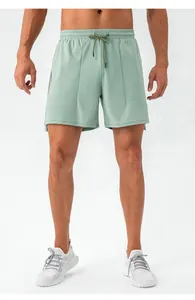 Detailed front view of men's mint green quick-dry sports shorts for running