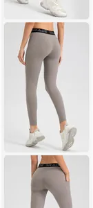 Detailed back view of high-waisted taupe yoga leggings featuring functional side pocket